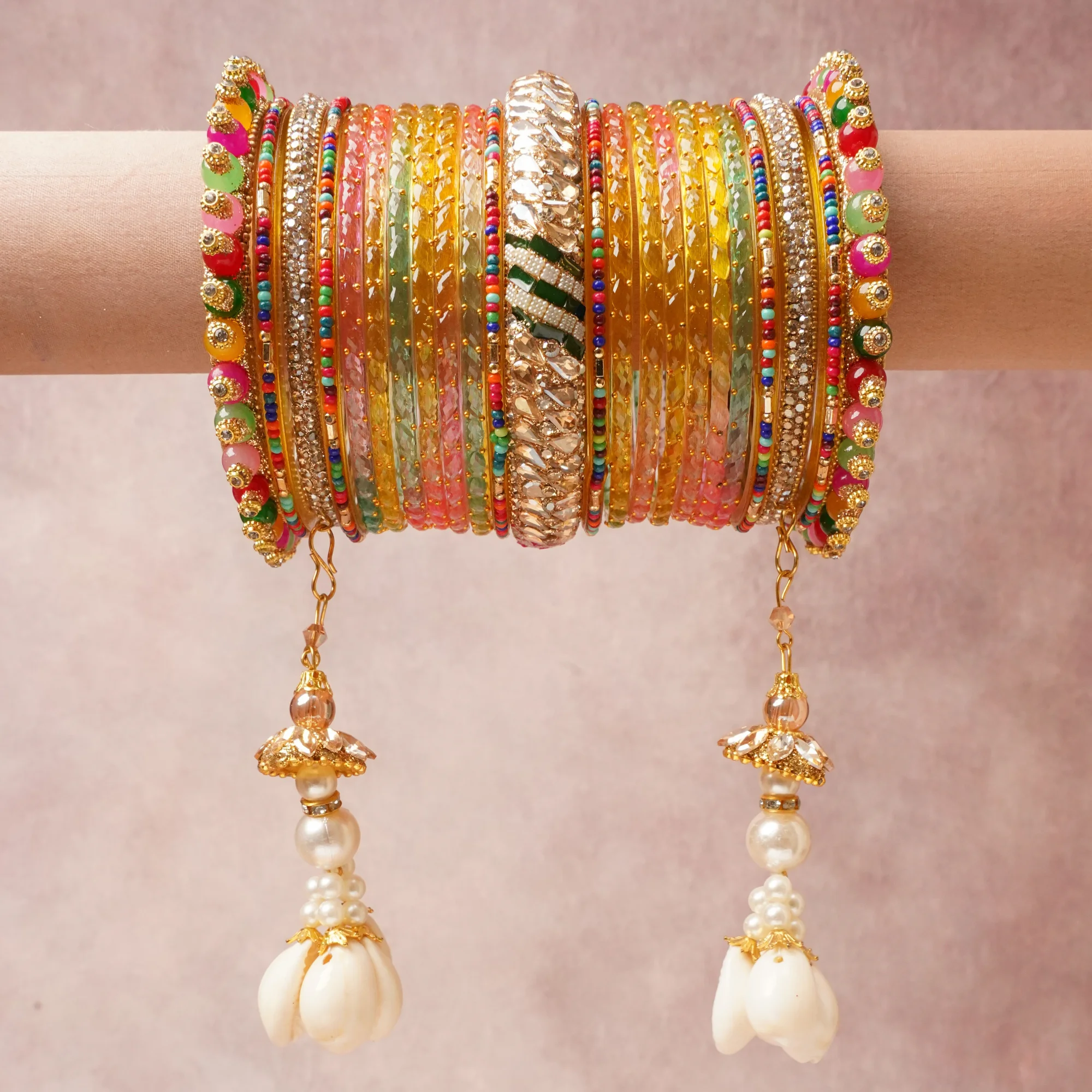 A majestic Multi colour set, complemented by Pink, Mint Green, Teal Blue, Crimson Red, Burnt Orange, Amethyst Purple, Canary Yellow, Pearl White, Jet Black, Clear featuring Gold-toned Metal, Glass, Resin, Rhinestones, Seed Beads, Enamel, Faux Pearls, Cowrie Shells.
Rich, ceremonial, and designed to be passed through generations.